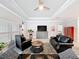 Spacious living room boasts tile floors, tray ceiling, and comfortable seating, perfect for entertaining at 4082 Watson Dr, New Port Richey, FL 34655