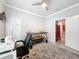 Cozy office features neutral paint, ceiling fan, sewing machine, and custom decorations at 4082 Watson Dr, New Port Richey, FL 34655