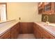 A bar area showcases wood cabinets, a sink, and a view to the outside at 4269 River Birch Dr, Spring Hill, FL 34607