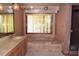 Bathroom featuring a vanity, jacuzzi style tub, and a window at 4269 River Birch Dr, Spring Hill, FL 34607