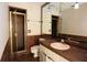 Tiled bathroom featuring a shower, toilet, mirror, sink, and vanity at 4269 River Birch Dr, Spring Hill, FL 34607