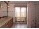 Bathroom featuring a vanity with dual sinks and a shower at 4269 River Birch Dr, Spring Hill, FL 34607