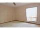 Bedroom featuring neutral wallpaper and carpet with a bright window at 4269 River Birch Dr, Spring Hill, FL 34607