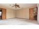 Spacious bedroom offers carpeting, neutral wall coverings, and dual entry doors at 4269 River Birch Dr, Spring Hill, FL 34607