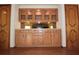 Wooden built-in cabinet features decorative glass doors and wood drawers at 4269 River Birch Dr, Spring Hill, FL 34607