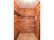 View of a cedar-lined closet with metal racks for storage at 4269 River Birch Dr, Spring Hill, FL 34607