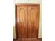 A solid wood double door with decorative panels adds character to the home at 4269 River Birch Dr, Spring Hill, FL 34607