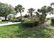 Landscaped front yard, showcasing the home's stone facade and well-maintained greenery, increasing curb appeal at 4269 River Birch Dr, Spring Hill, FL 34607