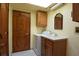 Laundry room featuring a washer, dryer, sink, and storage at 4269 River Birch Dr, Spring Hill, FL 34607