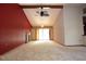 Bright living room with vaulted ceilings, large windows, and access to the backyard at 4269 River Birch Dr, Spring Hill, FL 34607