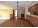 Open-concept living area with wood floors and doorway to additional rooms in the home at 4269 River Birch Dr, Spring Hill, FL 34607