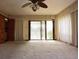 The living room is spacious, featuring sliding glass doors and neutral carpeting at 4269 River Birch Dr, Spring Hill, FL 34607