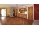 View of open living room with hardwood flooring and a built-in wood cabinet at 4269 River Birch Dr, Spring Hill, FL 34607