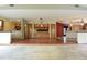 Spacious living room showcases hardwood floors and a built-in wood cabinet with glass doors at 4269 River Birch Dr, Spring Hill, FL 34607