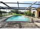 Screened-in pool with a view of the lake at 4269 River Birch Dr, Spring Hill, FL 34607