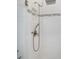 Modern bathroom with a sleek shower featuring white tiles, a handheld sprayer, and a built-in niche at 4287 Woodland Retreat Blvd, New Port Richey, FL 34655