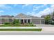 Charming one-story home with a manicured lawn, colorful flower beds, and a spacious three-car garage at 4287 Woodland Retreat Blvd, New Port Richey, FL 34655