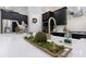 Kitchen island decor with a quartz countertop and trendy golden faucet, creating a bright and inviting space at 4287 Woodland Retreat Blvd, New Port Richey, FL 34655