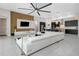 Open living space featuring living and kitchen areas with tile floors and a ceiling fan at 4287 Woodland Retreat Blvd, New Port Richey, FL 34655