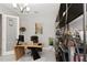Office with wood desk, stylish shelving, and luxury decor at 4287 Woodland Retreat Blvd, New Port Richey, FL 34655