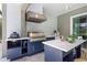 The outdoor kitchen boasts stainless steel appliances and ample counter space at 4287 Woodland Retreat Blvd, New Port Richey, FL 34655