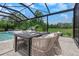 Outdoor patio dining area overlooks a lush green lawn at 4287 Woodland Retreat Blvd, New Port Richey, FL 34655