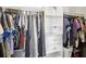 Spacious walk-in closet with plenty of hanging storage and built-in shelving for optimal organization at 4716 Wolfram Ln, New Port Richey, FL 34653