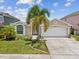 Welcoming single-story home with a two-car garage and well maintained lawn at 4716 Wolfram Ln, New Port Richey, FL 34653