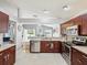 Modern kitchen featuring stainless steel appliances, granite countertops, and an open layout, great for entertaining guests at 4716 Wolfram Ln, New Port Richey, FL 34653
