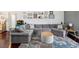 Cozy living room featuring a large sectional sofa, decorative rug, and stylish decor for a comfortable gathering space at 4716 Wolfram Ln, New Port Richey, FL 34653