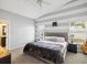 Cozy bedroom featuring a plush bed, accent wall, and two bedside tables at 4716 Wolfram Ln, New Port Richey, FL 34653