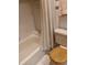 Bright bathroom featuring a shower with curtain and wooden toilet seat at 6050 Chesham Dr # 3, New Port Richey, FL 34653