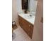 Bathroom with a large sink, wood vanity, and tile flooring at 6050 Chesham Dr # 3, New Port Richey, FL 34653
