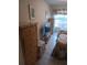 Bedroom with wicker dressers, tile floors, and bright natural light at 6050 Chesham Dr # 3, New Port Richey, FL 34653