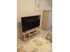 Bedroom featuring a TV, stand, dresser, coordinated seashell themed decor, and inviting ambiance at 6050 Chesham Dr # 3, New Port Richey, FL 34653
