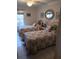 Inviting bedroom featuring two twin beds, seashell decor, and tile flooring at 6050 Chesham Dr # 3, New Port Richey, FL 34653