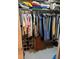 Walk-in closet with hanging clothes and shelving for shoes and other accessories, maximizing storage at 6050 Chesham Dr # 3, New Port Richey, FL 34653