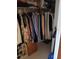 Walk-in closet with hanging clothes and shelf with shoes at 6050 Chesham Dr # 3, New Port Richey, FL 34653