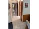 Hallway with tile flooring, and multiple doors leading to other rooms at 6050 Chesham Dr # 3, New Port Richey, FL 34653
