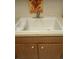 Kitchen sink with updated faucet and a white sink basin with laminate countertop at 6050 Chesham Dr # 3, New Port Richey, FL 34653