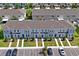 Overhead view of townhomes, showcasing parking, landscaping, and a well-maintained community at 6240 Fairmont Ln, Palmetto, FL 34221