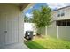 A cozy fenced-in backyard featuring an AC unit and a lush green lawn at 6240 Fairmont Ln, Palmetto, FL 34221