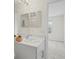 Bright bathroom featuring a white single sink vanity and neutral wall colors at 6240 Fairmont Ln, Palmetto, FL 34221