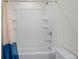 Clean bathroom with a white tiled shower-tub and a blue-and-white shower curtain at 6240 Fairmont Ln, Palmetto, FL 34221