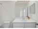 Bright bathroom featuring a white vanity with a solid surface countertop and modern fixtures at 6240 Fairmont Ln, Palmetto, FL 34221