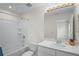 Well-lit bathroom featuring a shower-tub combination and a vanity with modern fixtures at 6240 Fairmont Ln, Palmetto, FL 34221