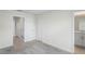 Bedroom with neutral carpeting featuring a closet and bathroom at 6240 Fairmont Ln, Palmetto, FL 34221