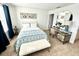 Bedroom featuring a bed and a small desk with an oval mirror above it at 6240 Fairmont Ln, Palmetto, FL 34221