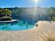 A community pool with a brick paver deck and comfortable lounge chairs at 6240 Fairmont Ln, Palmetto, FL 34221