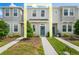Charming townhome with neutral exterior, well-maintained landscaping, and inviting blue front door with wreath at 6240 Fairmont Ln, Palmetto, FL 34221
